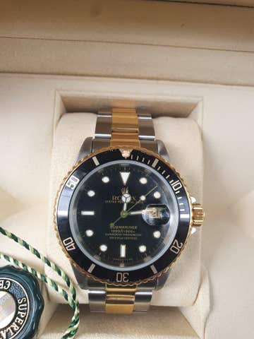 Rolex submariner acero y oro