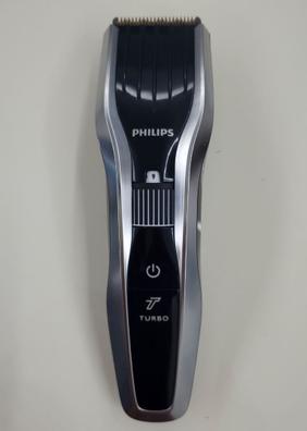 Philips Cortapelos con cuchillas de titanio, 3 Peines guía, 28