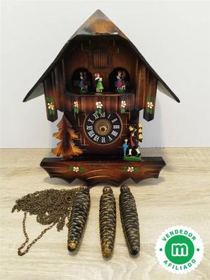 Reloj de cuco grande de la selva negra con movimiento de figuras.